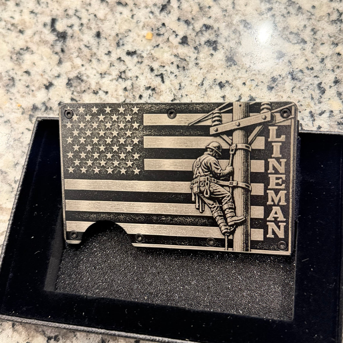 Lineman wallet with engraved American flag and utility pole design