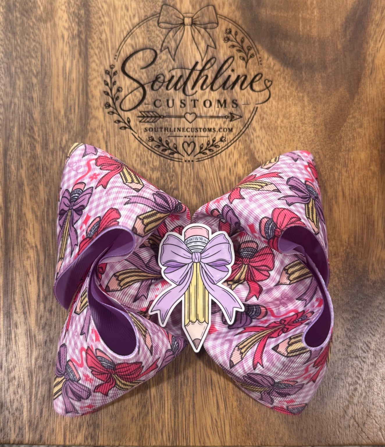 Pink pencil school hair bow with Southline Customs background